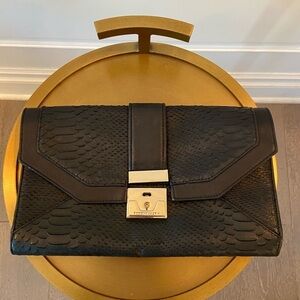 Black snake skin / leather BCBG clutch